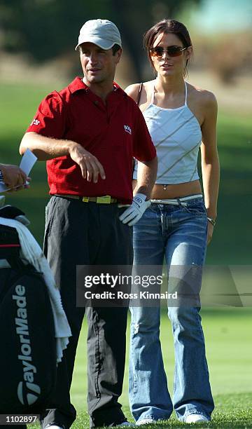 Susie Amy, ''Chardonny'' form the TV series Footballers Wives with boyfriend and golfer Steve Webster of England on the 5th hole during his practice...