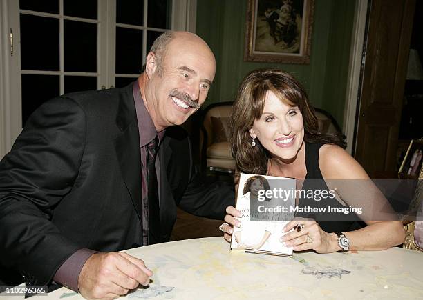 Dr. Phil McGraw and Robin McGraw during Robin McGraw Signs Her Book "Inside My Heart" - Party at Private Residence in Bel Air, California, United...