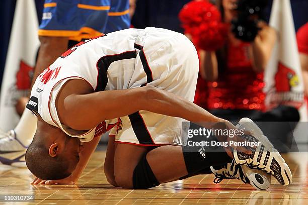 Preston Knowles of the Louisville Cardinals reacts after an injury while playing against the Morehead State Eagles during the second round of the...