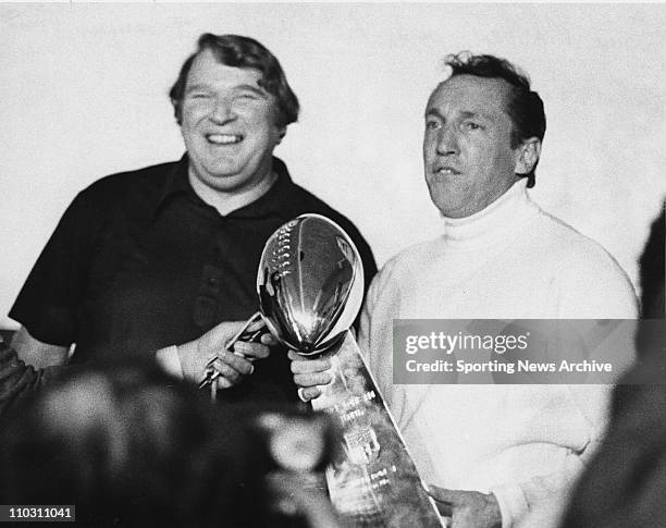 Jan 09, 1977; Pasadena, CA, USA; Raiders head coach John Madden. Left, and owner Al Davis hold the super bowl trophy after the Oakland Raiders...
