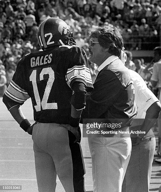 May 02, 1981 - Iowa, Iowa, USA - Iowa head football coach HAYDEN FRY talks with Pete Gales in 1981.