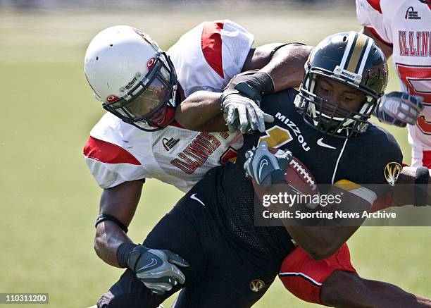 Jan 22, 2000 - Columbia, MO, USA - Illinois State's JESSE CAESAR tackles Missouri's JIMMY JACKSON at the University of Missouri Memorial Stadium in...