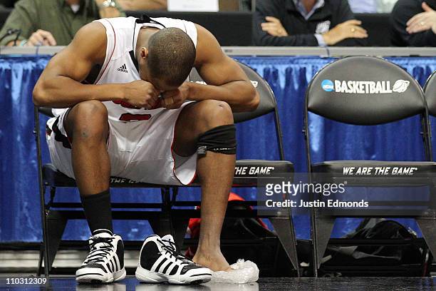 Preston Knowles of the Louisville Cardinals reacts after coming out of the game because of an injury while playing against the Morehead State Eagles...