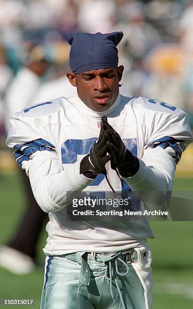 Deion Sanders of the Dallas Cowboys gets ready prior to the Cowboys victory over the Pittsburgh Steelers in Super Bowl XXX at Sun Devil Stadium in...