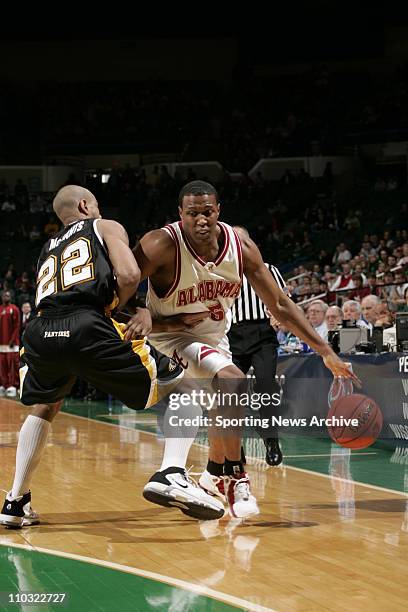 College Basketball - University of Wisconsin-MIlwaukee Ed McCants against Alabama Earnest Shelton during the first round of the NCAA Tournament on...