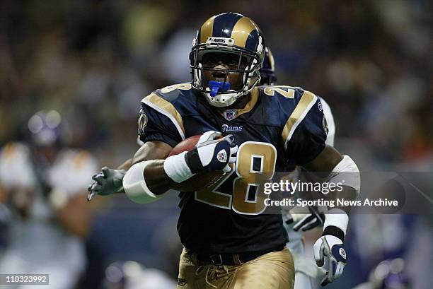 Marshall Faulk of the St. Louis Rams during the Rams 48-17 victory over the Minnesota Vikings at the Edward Jones Dome in St. Louis, MO.