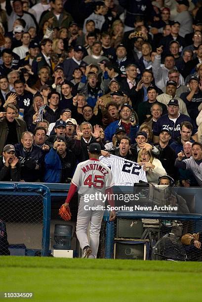 Pedro Martinez of the Boston Red Sox leaves the game during the Sox's 6-5 loss to the New York Yankees in game 7 of the ALCS at Yankee Stadium in New...