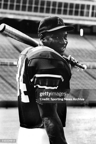 Auburn's multisport talent Bo Jackson poses with football pads and a baseball bat in 1985.
