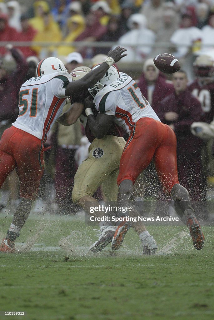 Florida State quarterback Chris Rix looses the football as Miami's ...