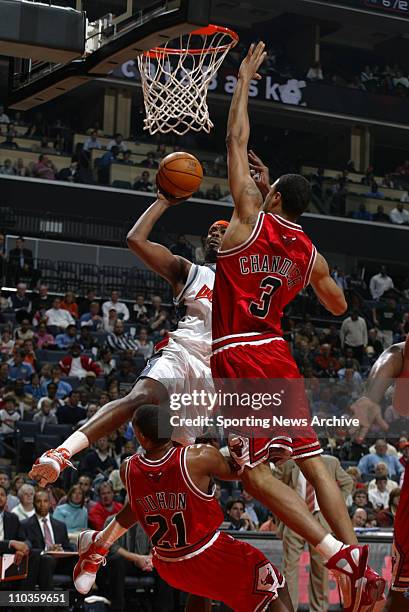 Dec 28, 2005; Charlotte, NC, USA; The Chicago Bulls CHRIS DUHON and TYSON CHANDLER against the Charlotte Bobcats MELVIN ELY on Dec. 28 at the...