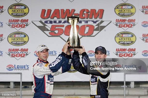 Oct 13, 2005; Concord, NC, USA; Crew Cheif CHAD KNAUS and JIMMY JOHNSON after he won the Nextel Cup UAW-GM Quality 500 trophy at Lowe's Motor...