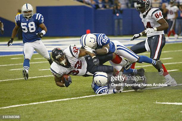 Nov 13, 2005; Indianapolis, IN, USA; NFL FOOTBALL: The Houston Texans Jonathan Wells against the Indianapolis Colts Marlin Jackson and Jason David in...