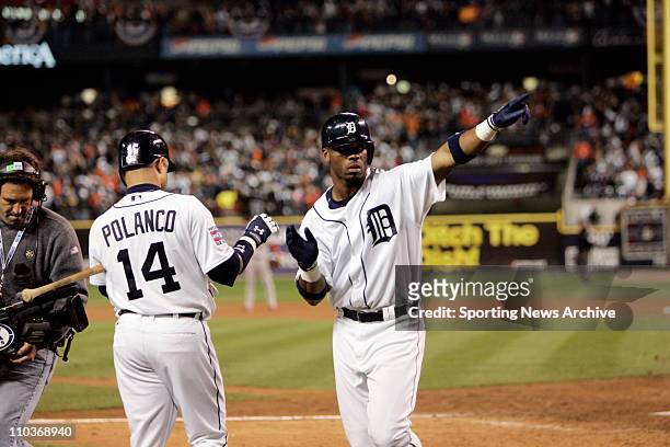 Oct 21, 2006 - Detroit, MI, USA - Detroit Tigers CRAIG MONROE and PLACIDO POLANCO celebrate Monroe's home run during Game 1 of the World Series...
