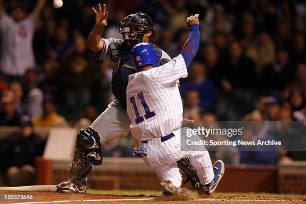 May 17, 2006; Chicago, IL, USA; The Washington D.C. Nationals Wiki Gonzalez against the Chicago Cubs Jacque Jones in Chicago. The Cubs won 5-0.