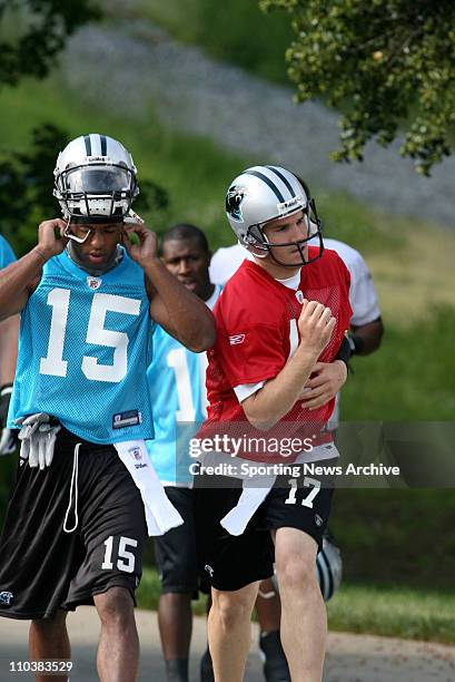 The Carolina Panthers Jake Delhomme runs by teammate, Kevin McMahan on the way to Mini-Camp on May 1, 2009 in Charlotte, NC.
