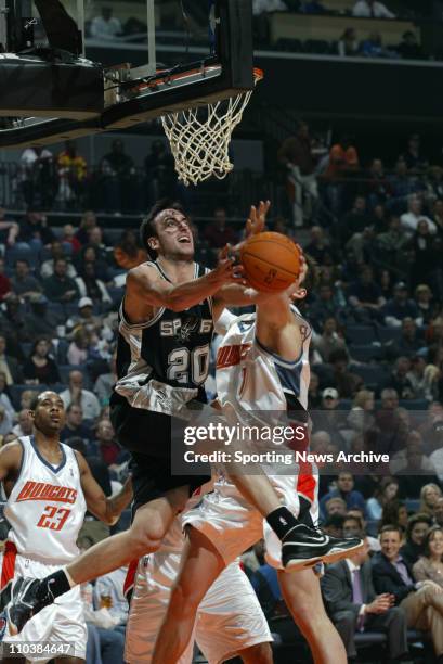 Dec 06, 2006; Charlotte, NC, USA; San Antonio Spurs MANU GINOBILI against Charlotte Bobcats PRIMOZ BREZEC on Dec. 6 at the Charlotte Bobcats Arena in...