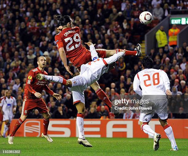 Andy Carroll of Liverpool tries a header during the UEFA Europa League round of 16 second leg match between Liverpool and Braga at Anfield on March...