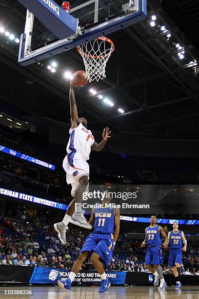 Kenny Boynton of the Florida Gators drives for a shot attempt against Justin Joyner of the UC Santa Barbara Gauchos during the second round of the...