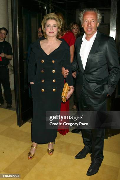 Catherine Deneuve and Gilles Bensimon during 2005 CFDA Fashion Awards - Inside at New York Public Library in New York City, New York, United States.