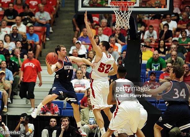 Drew Hanlen of the Belmont Bruins passes around Keaton Nankivil of the Wisconsin Badgers during the second round of the 2011 NCAA men's basketball...