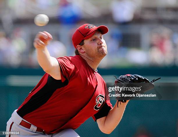 Pitcher Aaron Heilman of the Arizona Diamondbacks throws a pitch against the Los Angeles Dodgers during the spring training baseball game on March...
