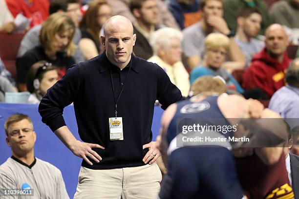 Head coach Cael Sanderson of the Penn State Nittany Lions watches one of his wrestlers during the NCAA Wrestling Championships on March 17, 2011 at...