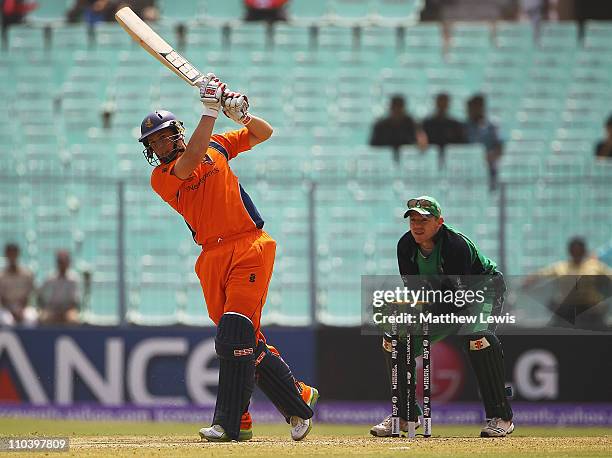Wesley Barresi of the Netherlands hits the ball towards the boundary, as Niall O'Brien of Ireland looks onduring the 2011 ICC World Cup match between...