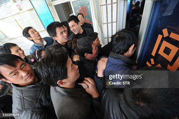 In a picture taken on March 17, 2011 Chinese shoppers crowd a shop in an effort to buy salt in Hefei, Anhui province. Chinese retailers on March 17...