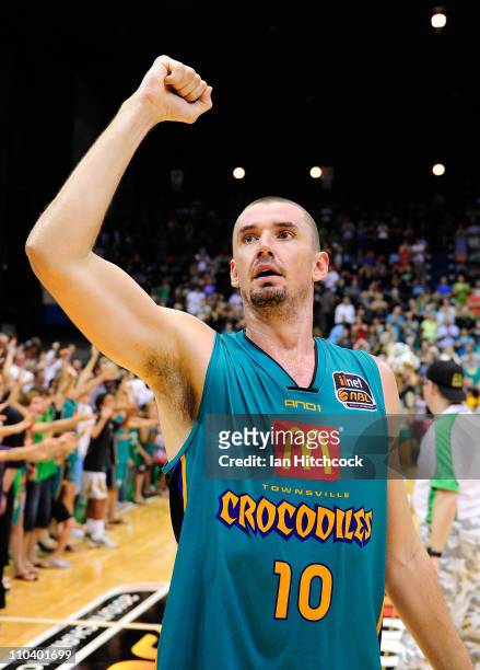 Russell Hinder of the Crocodiles waves to the crowd after winning the round 23 NBL match between the Townsville Crocodiles and the Perth Wildcats at...