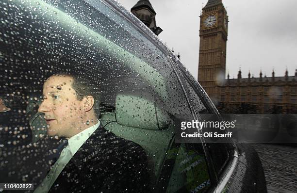 British prime Minister David Cameron leaves the Houses of Parliament after addressing the Commons on March 18, 2011 in London, England. UK defence...