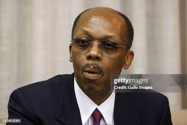 Former President of Haiti Jean-Bertrand Aristide reads a statement, which he prepared in Zulu, at Lanseria airport on March 17, 2011 in Johannesburg,...