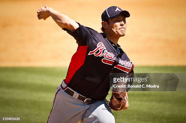 Pitcher Kenshin Kawakami of the Atlanta Braves pitches during a spring training game against the St. Louis Cardinals at Donald Ross Stadium on March...