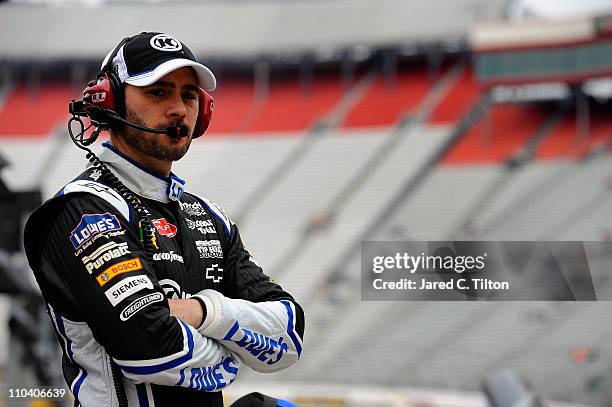 Jimmie Johnson, driver of the Lowe's/Kobalt Tools Chevrolet, stands in the garage area during practice for the NASCAR Sprint Cup Series Jeff Byrd 500...