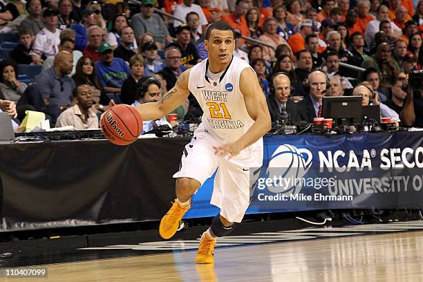 Joe Mazzulla of the West Virginia Mountaineers drives against the Clemson Tigers during the second round of the 2011 NCAA men's basketball tournament...