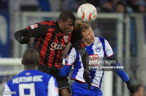 Edson Buddle of Ingolstadt heads for the ball with Fabian Lustenberger of Hertha BSC during the second Bundesliga match between FC Ingolstadt and...