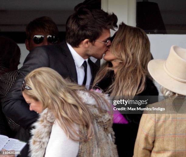 Leandro Penna kisses Katie Price as they attend day 4 'Gold Cup Day' of the Cheltenham Festival at Cheltenham Racecourse on March 18, 2011 in...