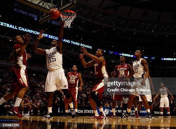 Texas A&M's Ray Turner goes up for the loose ball against Florida State's Terrance Shannon, left, and Xavier Gibson during second-round action in the...