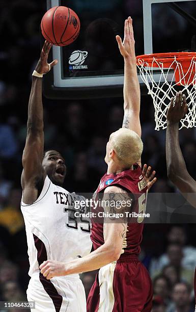 Texas A&M forward Ray Turner shoots over Florida State defender Jon Kreft during the first half of a second round game in the 2011 NCAA men's...