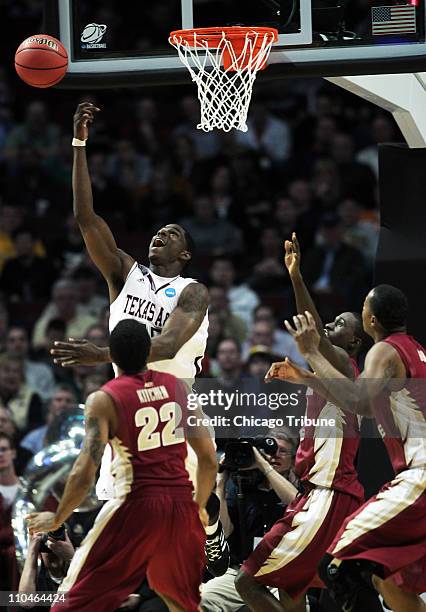 Texas A&M forward Ray Turner loses control of the ball against Florida State during the first half of a second round game in the 2011 NCAA men's...