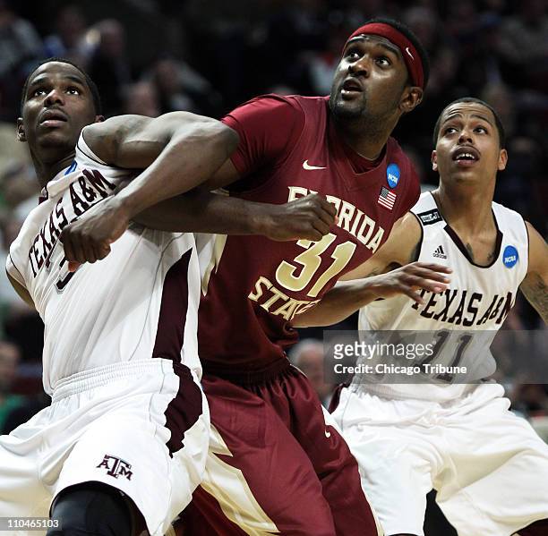 Texas A&M forward Ray Turner, left, battles for position with Florida State forward Chris Singleton during the first half of a second round game in...