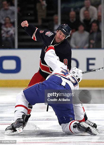 Brandon Prust of the New York Rangers fights with Travis Moen of the Montreal Canadiens during their game on March 18, 2011 at Madison Square Garden...