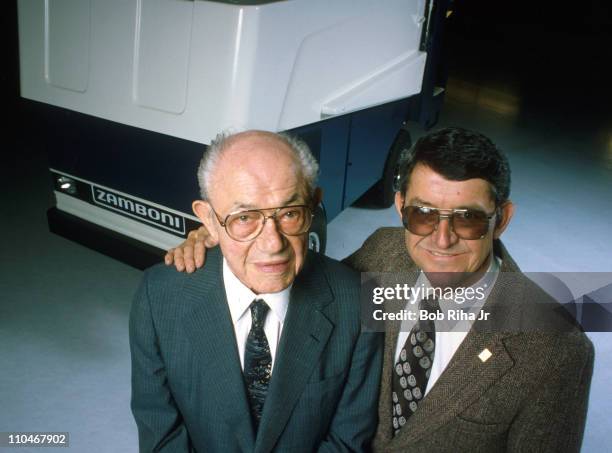 Ice resurfacing machine pioneers Frank Zamboni and his son Richard Zamboni with their Zamboni Ice Rink machine in background. The machine is used...