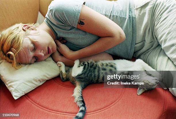 Girl and kitten sleeping