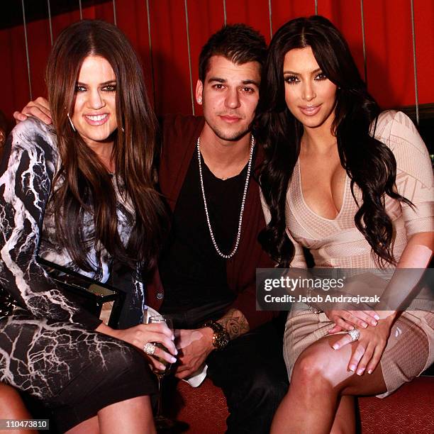 Khloe Kardashian, Rob Kardashian and Kim Kardashian pose at Jet at The Mirage Hotel and Casino on March 18, 2011 in Las Vegas, Nevada.