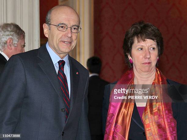 French Foreign minister Alain Juppe and European Union foreign policy chief Catherine Ashton arrive at the Foreign Affairs ministry in Paris, on...