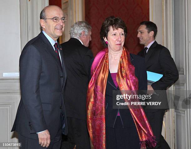 French Foreign minister Alain Juppe and European Union foreign policy chief Catherine Ashton arrive at the Foreign Affairs ministry in Paris, on...