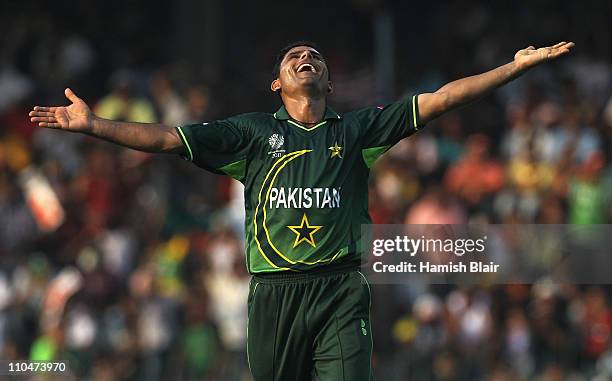 Abdul Razzaq of Pakistan celebrates the wicket of Mitchell Johnson of Australia during the 2011 ICC World Cup Group A match between Australia and...