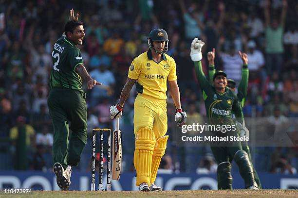 Mitchell Johnson of Australia is caught by wicketkeeper Kamran Akmal off the bowling of Abdul Razzaq during the 2011 ICC World Cup Group A match...