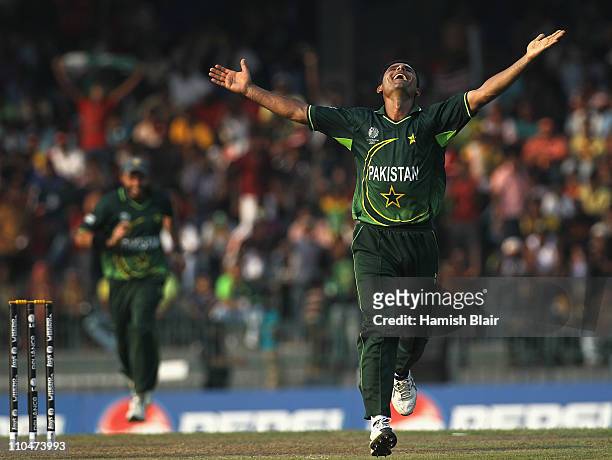 Abdul Razzaq of Pakistan celebrates the wicket of Mitchell Johnson of Australia during the 2011 ICC World Cup Group A match between Australia and...