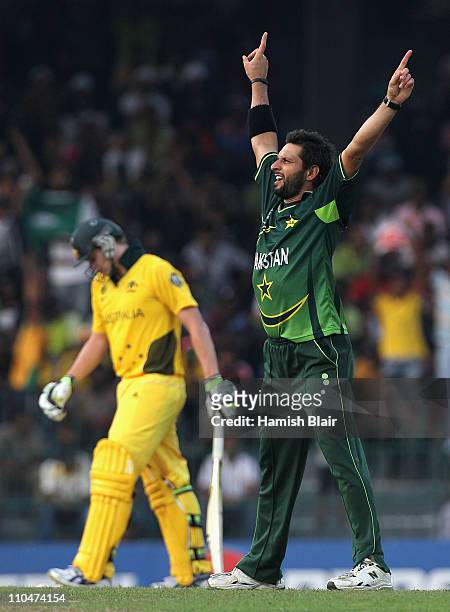 Shahid Afridi of Pakistan celebrates the wicket of Steven Smith of Australia during the 2011 ICC World Cup Group A match between Australia and...